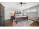 Spacious bedroom with hardwood floors, neutral colors, ceiling fan, and natural light at 785 Bay Esplanade, Clearwater Beach, FL 33767