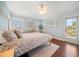 Light-filled bedroom with a four-poster bed, shutters, and access to a balcony at 785 Bay Esplanade, Clearwater Beach, FL 33767