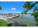 Home boasts private boat dock access to waterfront and serene views at 785 Bay Esplanade, Clearwater Beach, FL 33767