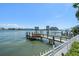 Private wooden dock with a picturesque waterfront setting, offering a tranquil escape at 785 Bay Esplanade, Clearwater Beach, FL 33767
