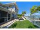 View of screened in porch, patio, and dock from the back of the home at 785 Bay Esplanade, Clearwater Beach, FL 33767