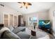 Living room with a grey couch, bar area, and a view of the outside at 785 Bay Esplanade, Clearwater Beach, FL 33767