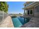 Sparkling pool and spa overlooking the waterfront, providing a serene outdoor oasis with ample space to relax at 785 Bay Esplanade, Clearwater Beach, FL 33767