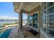 Back porch overlooking pool, canal, and blue skies at 785 Bay Esplanade, Clearwater Beach, FL 33767