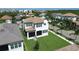 Stunning aerial view of a home with a tile roof and beautiful landscaping at 923 Seagrape Dr, Ruskin, FL 33570