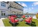 Outdoor amenity featuring a fire pit, comfortable seating, a pool, and marina views at 923 Seagrape Dr, Ruskin, FL 33570