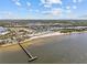 Overhead view of a beach near a marina and restaurant, with clear waters and inviting sand at 923 Seagrape Dr, Ruskin, FL 33570