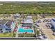 Community amenities with a sparkling pool, lounge chairs, and well-manicured landscaping for relaxation and enjoyment at 923 Seagrape Dr, Ruskin, FL 33570