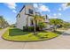 Well-maintained home featuring lush green landscaping and a spacious front lawn, adding to its curb appeal at 923 Seagrape Dr, Ruskin, FL 33570