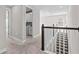 Upstairs hallway featuring carpet flooring and a view of the laundry room and staircase at 923 Seagrape Dr, Ruskin, FL 33570