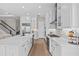 Bright kitchen featuring white cabinetry, stainless steel appliances, and a spacious center island at 923 Seagrape Dr, Ruskin, FL 33570