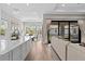 Bright kitchen with stainless steel appliances, center island, and views to a dining space at 923 Seagrape Dr, Ruskin, FL 33570