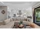 Open-concept living area with modern kitchen, dining space, and comfortable sectional sofa at 923 Seagrape Dr, Ruskin, FL 33570
