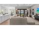 Spacious living room seamlessly connects to the kitchen and dining area, perfect for entertaining at 923 Seagrape Dr, Ruskin, FL 33570