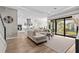 Bright living room with modern decor seamlessly flows into the kitchen, creating an inviting space at 923 Seagrape Dr, Ruskin, FL 33570