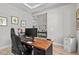 Office with desk, comfortable chair, and natural light streaming in for a productive work area at 923 Seagrape Dr, Ruskin, FL 33570