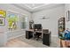 Bright office with two windows, modern desk, and neutral colors offer a productive workspace at 923 Seagrape Dr, Ruskin, FL 33570