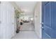 Inviting foyer with tile flooring that leads to the open-concept living room at 9807 Carlsdale Dr, Riverview, FL 33578