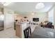 Open concept living space with bar, kitchen and living room at 9807 Carlsdale Dr, Riverview, FL 33578