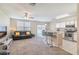 Open living room, features a bar and kitchen counter and view of the backyard at 9807 Carlsdale Dr, Riverview, FL 33578