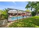 Backyard view with the pool and patio area, ideal for outdoor relaxation and activities at 11467 93Rd St, Largo, FL 33773