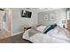 Bedroom with bed, wall-mounted TV, and light-green walls at 11467 93Rd St, Largo, FL 33773