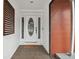 Inviting front entryway with a decorative glass door and a welcoming atmosphere at 11467 93Rd St, Largo, FL 33773