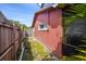 Side yard featuring a wooden fence and lush greenery. Perfect for outdoor activities at 11467 93Rd St, Largo, FL 33773
