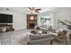 Cozy living room featuring a decorative fireplace, modern furnishings, and ample natural light at 11467 93Rd St, Largo, FL 33773