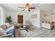 Bright living room with modern furniture and a view into the entryway at 11467 93Rd St, Largo, FL 33773
