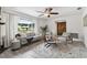 Bright living room boasts stylish decor, a comfortable seating area, and an open layout at 11467 93Rd St, Largo, FL 33773