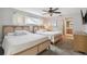 Comfortable bedroom featuring two beds with decorative headboards, a ceiling fan, and neutral decor at 11467 93Rd St, Largo, FL 33773
