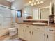 Bathroom featuring a vanity, neutral paint, and a glass shower at 1167 Lindenwood Dr, Tarpon Springs, FL 34688