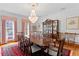 Formal dining room with a large table, chandelier, and decorative china cabinet at 1203 Parrilla De Avila, Tampa, FL 33613