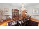 Spacious dining room featuring a chandelier, classic wainscoting, and hardwood floors at 1203 Parrilla De Avila, Tampa, FL 33613