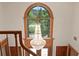 Elegant foyer featuring a grand chandelier and a view of the front entrance and manicured front yard at 1203 Parrilla De Avila, Tampa, FL 33613