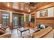 Inviting living room with fireplace, wood-paneled ceiling, built-in shelving, and access to the outdoors at 1203 Parrilla De Avila, Tampa, FL 33613