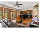 Spacious living room with hardwood floors, built-in shelving, and sliding glass doors to the outdoors at 1203 Parrilla De Avila, Tampa, FL 33613