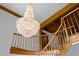 Low angle of staircase with a chandelier, wood railing, and trim at 1203 Parrilla De Avila, Tampa, FL 33613