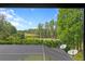 Expansive view of a golf course, lake, and lush greenery from a screened-in balcony at 1203 Parrilla De Avila, Tampa, FL 33613