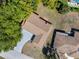 Aerial view showcasing the house, neighborhood, mature trees and proximity to community amenities at 12808 Candlewood Way, Hudson, FL 34667