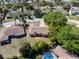 Aerial view of a single-story home featuring a private backyard with a screened pool and mature landscaping at 12808 Candlewood Way, Hudson, FL 34667