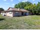 Large backyard with a patio area, perfect for outdoor entertaining, and a lush green lawn at 12808 Candlewood Way, Hudson, FL 34667