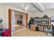 View of the bonus room with neutral flooring and access to another room. Lots of storage at 12808 Candlewood Way, Hudson, FL 34667