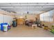 Spacious garage with overhead lighting, storage solutions, and ample room for vehicles at 12808 Candlewood Way, Hudson, FL 34667