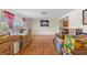 Living room showing hardwood floors and ample space; filled with moving boxes at 12808 Candlewood Way, Hudson, FL 34667