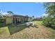Large backyard featuring a patio and plenty of space for outdoor activities at 1371 Meredith Dr, Spring Hill, FL 34608