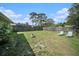 The large backyard has a lawn and a wood fence at 1371 Meredith Dr, Spring Hill, FL 34608