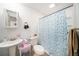 Bright bathroom with shower-tub combo and white fixtures at 1371 Meredith Dr, Spring Hill, FL 34608
