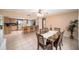 Open-concept dining and kitchen area with a modern dining set and matching countertops at 1371 Meredith Dr, Spring Hill, FL 34608